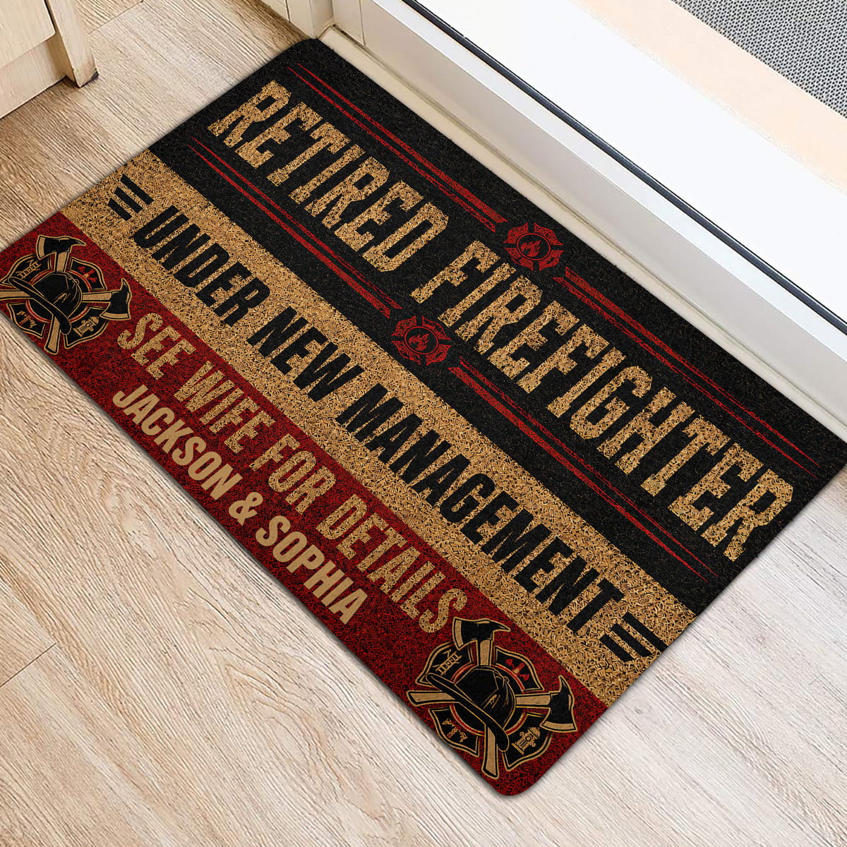 Firefighter door mat placed inside a doorway, featuring fire service emblems and bold decorative lettering