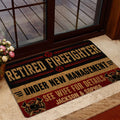 Firefighter entryway mat styled near a glass door with black, red, and gold fire service artwork