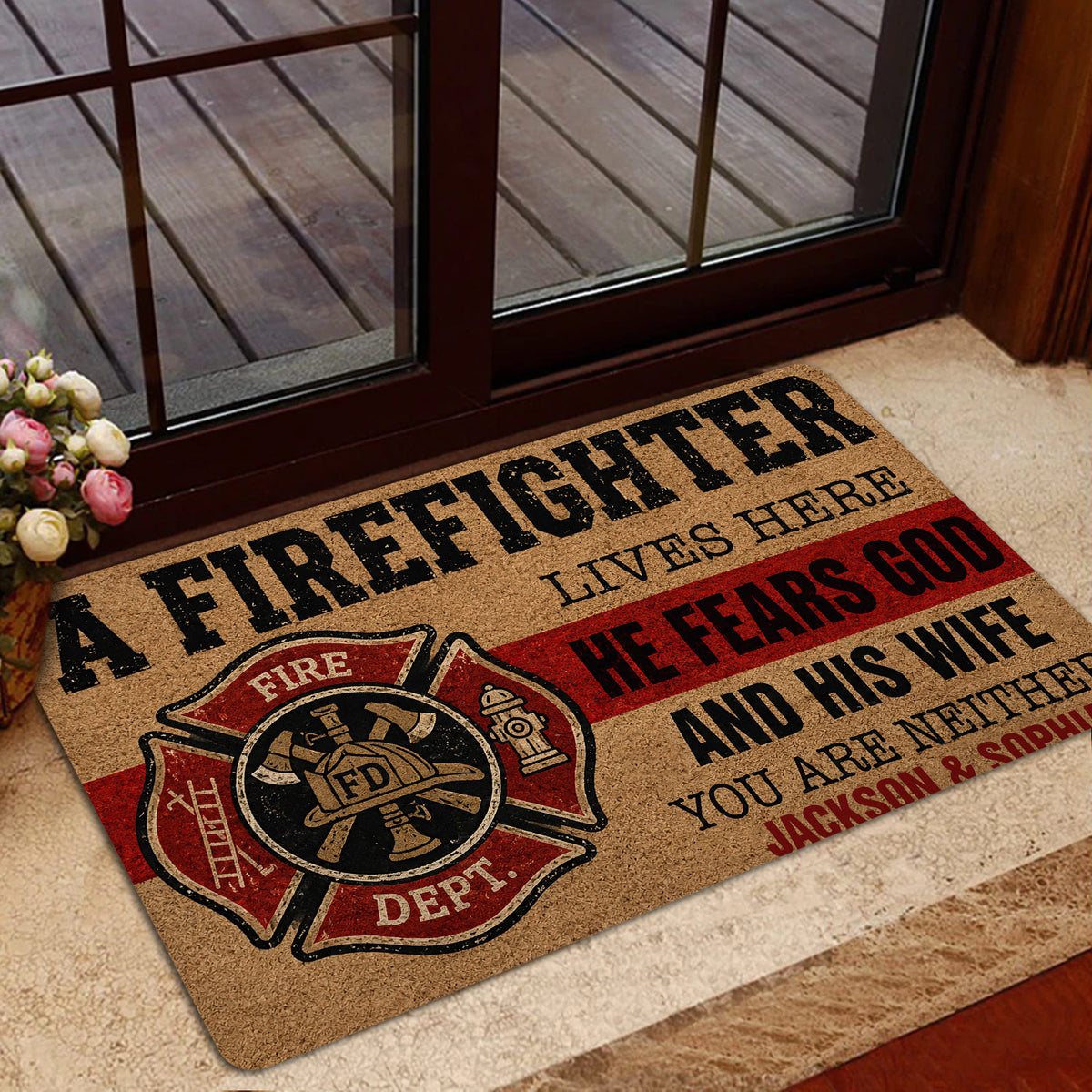 Firefighter door mat shown in a home entryway near a glass door and floral arrangement