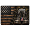 Veteran doormat featuring a distressed American flag, military boots, dog tags, woodgrain texture, and camouflage accents