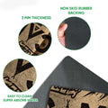 Close-up detail of the camping doormat surface and dark rubber backing with product feature callouts