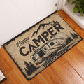 Camping entryway rug displayed beside a white door on a warm wood floor with trailer artwork