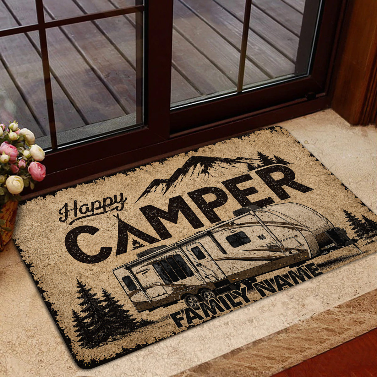 Camping-themed doormat displayed by a glass door with a travel trailer and mountain landscape design