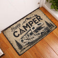 Camping RV doormat displayed by a white entry door on a hardwood floor