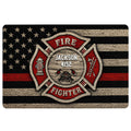 Firefighter doormat featuring a red and black fire department emblem over a distressed flag design