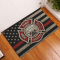Firefighter entryway doormat displayed on a wood floor beside a white door