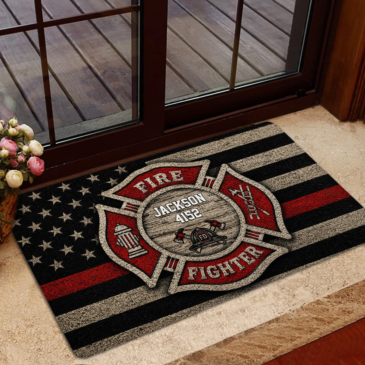Firefighter doormat displayed inside a home near glass doors and a carpeted entryway