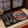 Patriotic military tribute doormat styled in a home entryway near a glass door