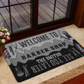 Barber shop doormat styled at a glass door with floral decor and an indoor entryway setting