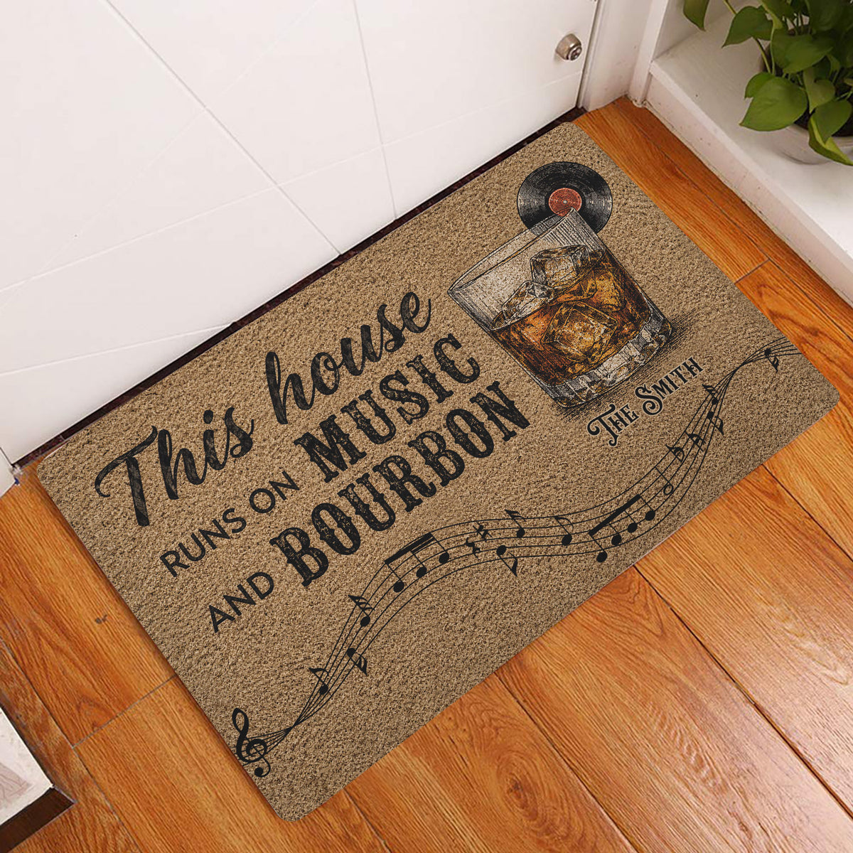 Bourbon-themed doormat displayed at an indoor entryway on a warm wood floor