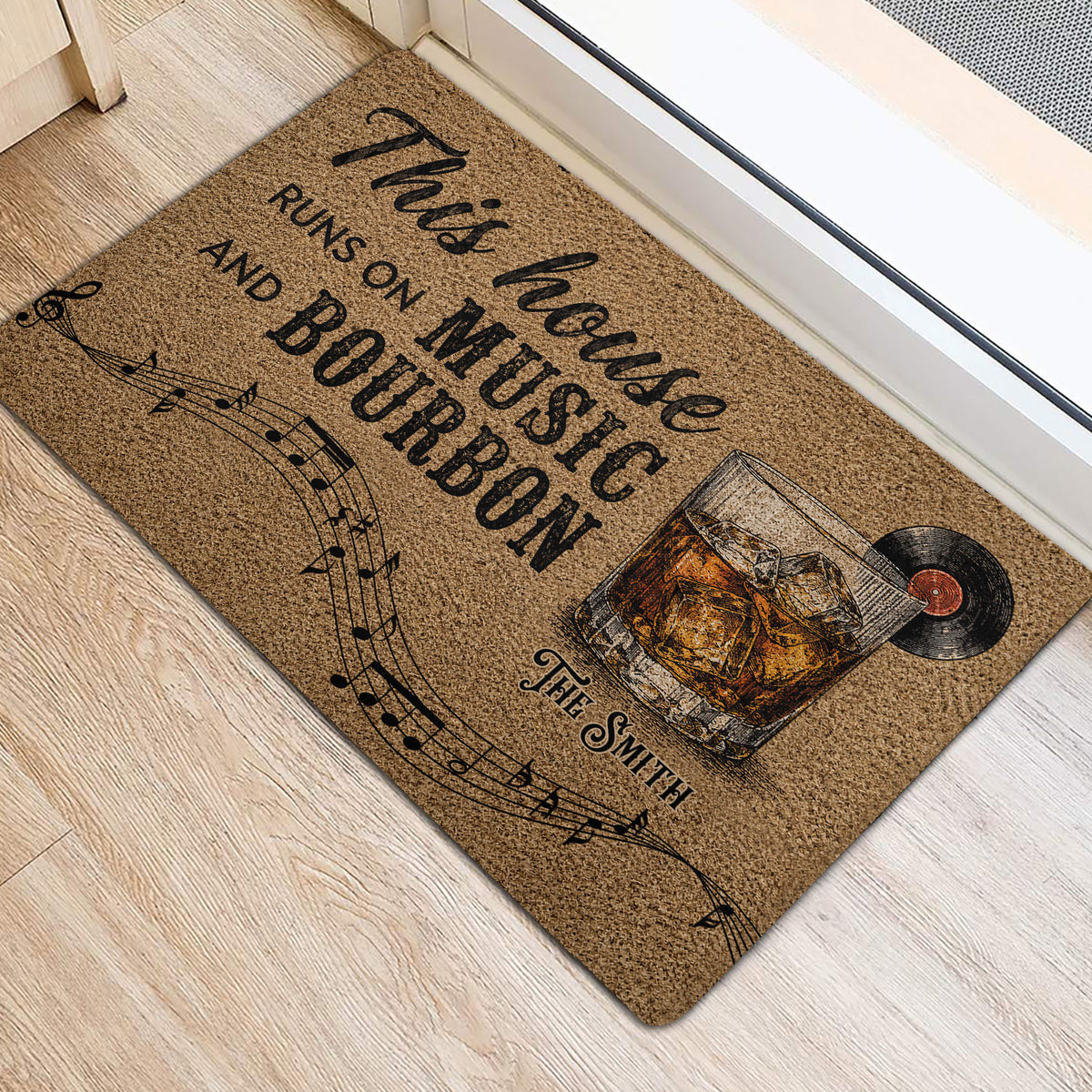 Bourbon and music doormat positioned beside a doorway on a light wood floor