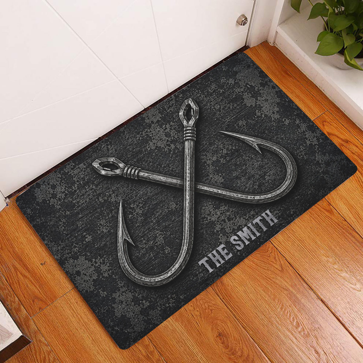 Fishing hook doormat styled in a home entryway on a warm wood floor