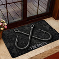 Black fishing doormat displayed in a home entrance with crossed hook artwork