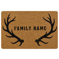 Rustic hunting doormat with black antler silhouettes and a central family name design