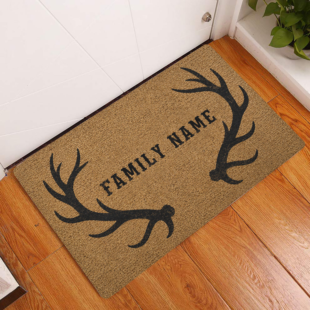 Antler hunting doormat displayed at a home entrance on a warm wood floor