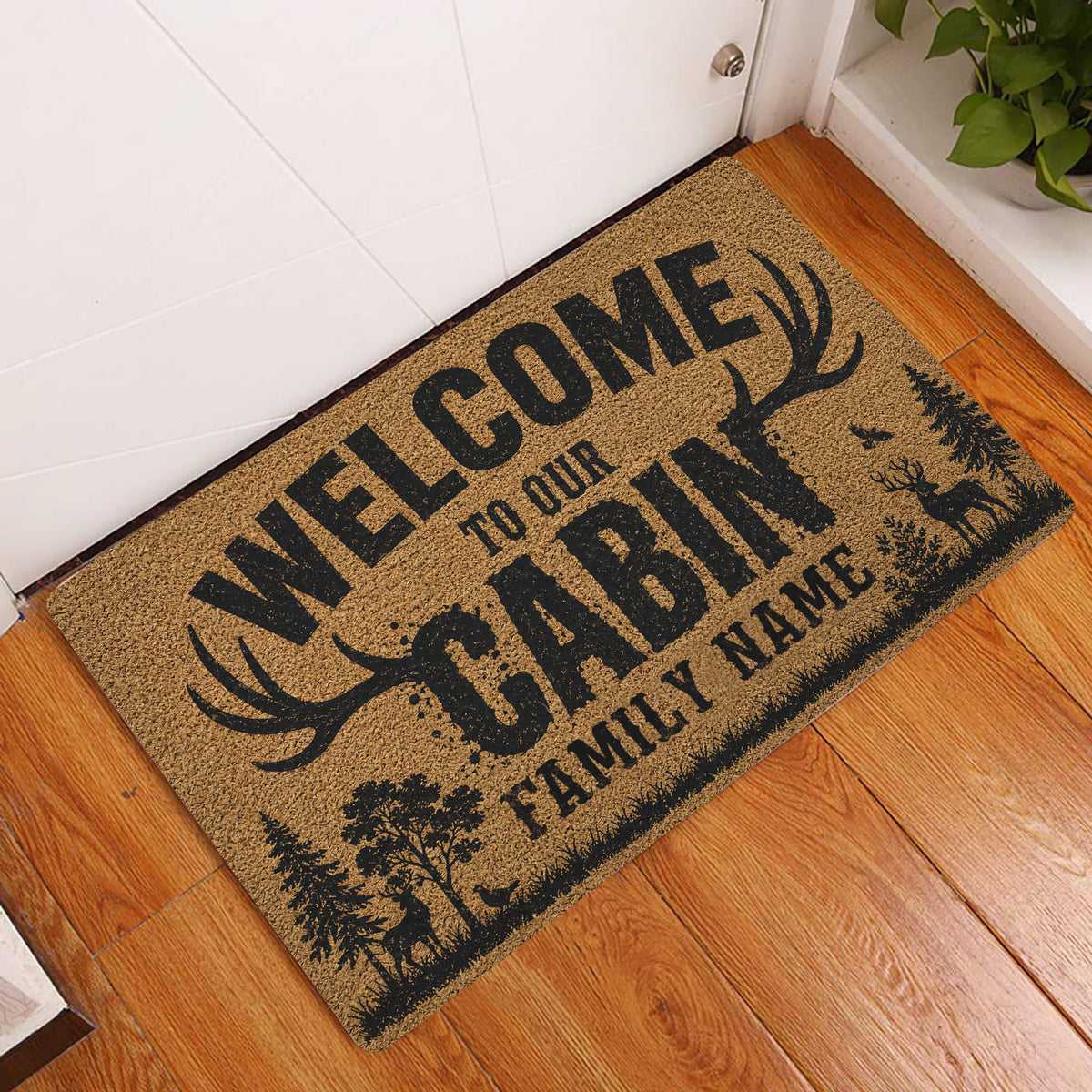 Hunting welcome doormat displayed in a wood-floored indoor entryway