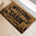 Deer hunting doormat placed beside a doorway on light wood flooring