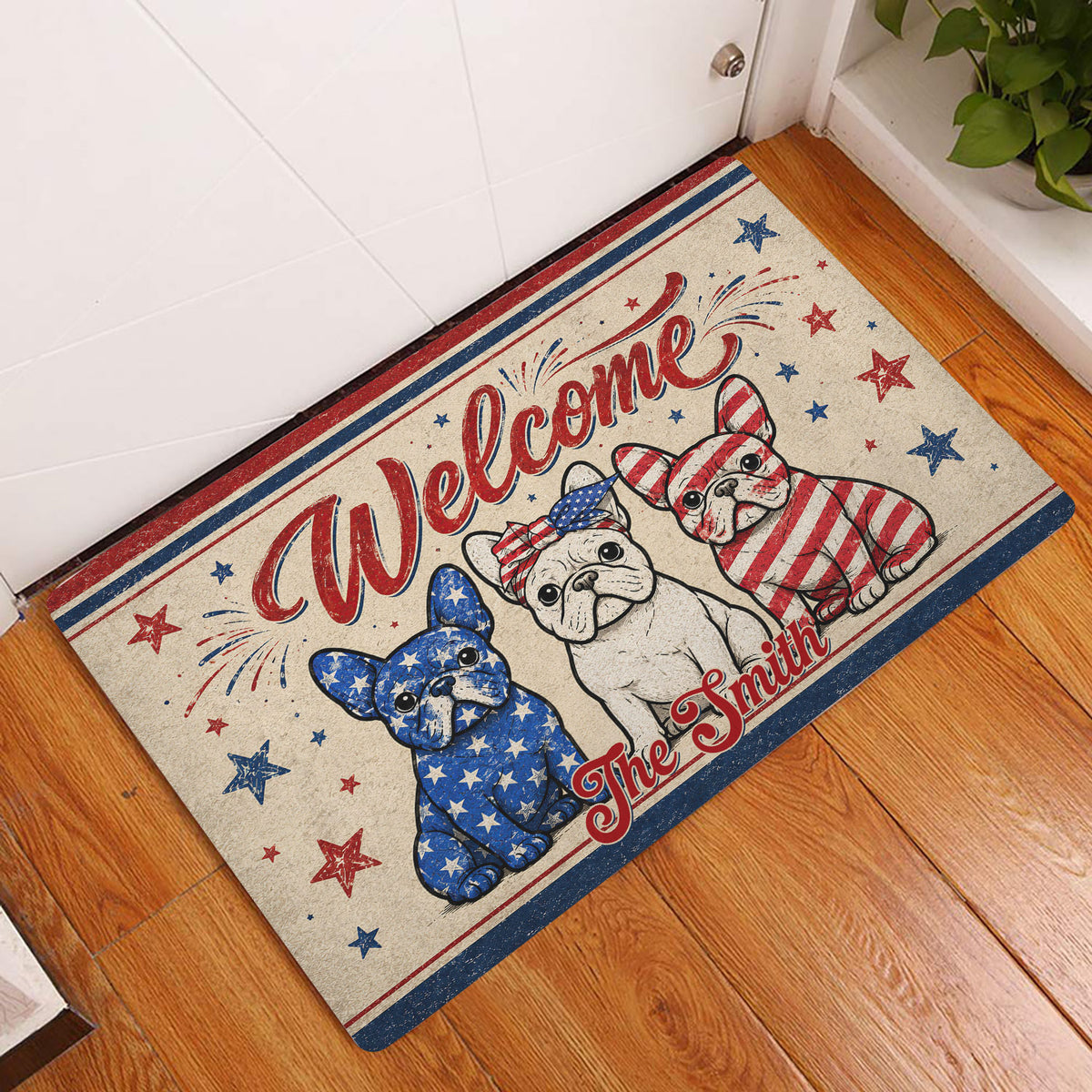 Patriotic French Bulldog welcome mat displayed at an indoor entryway on a wood floor