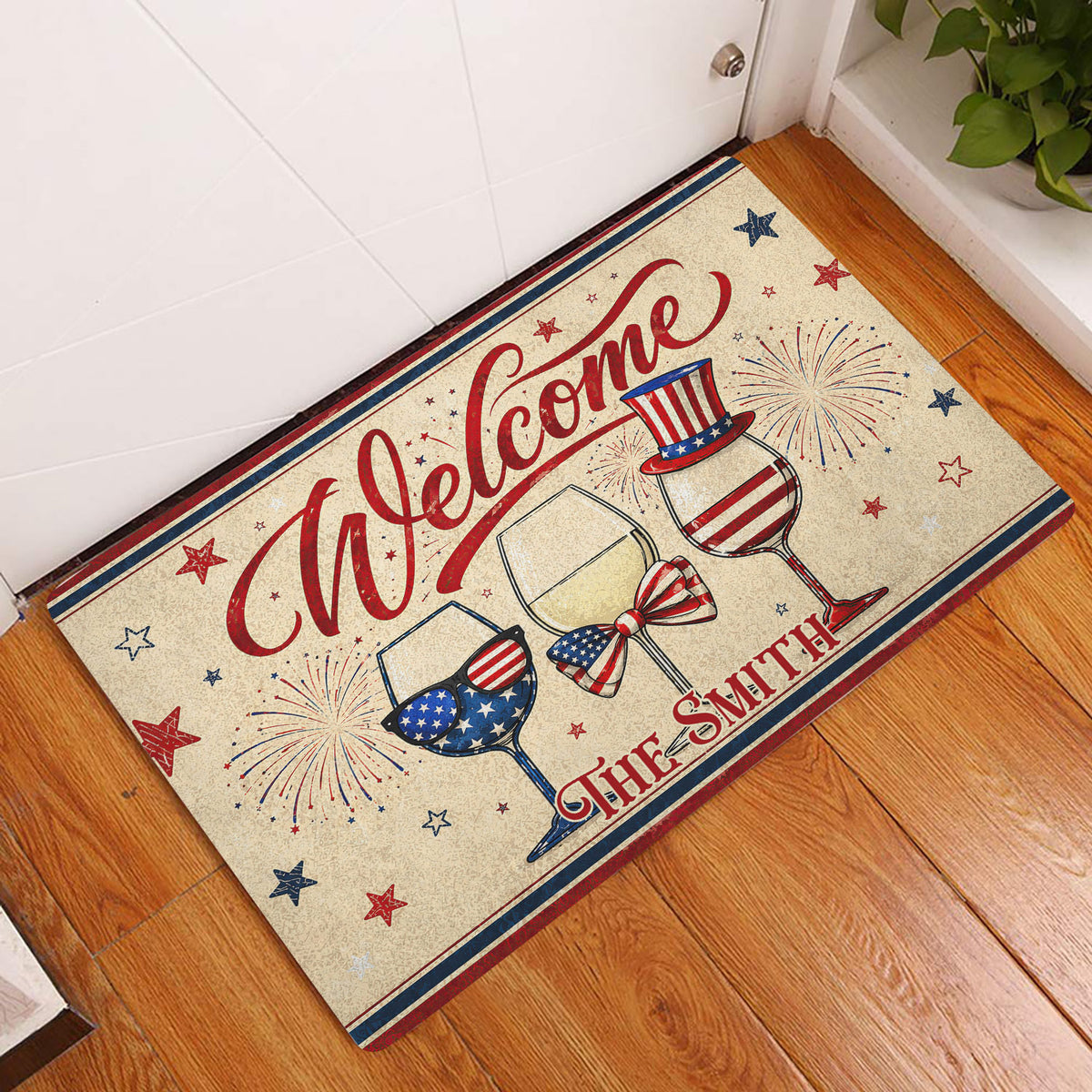 Patriotic wine-themed entryway rug displayed beside a white door on a wood floor