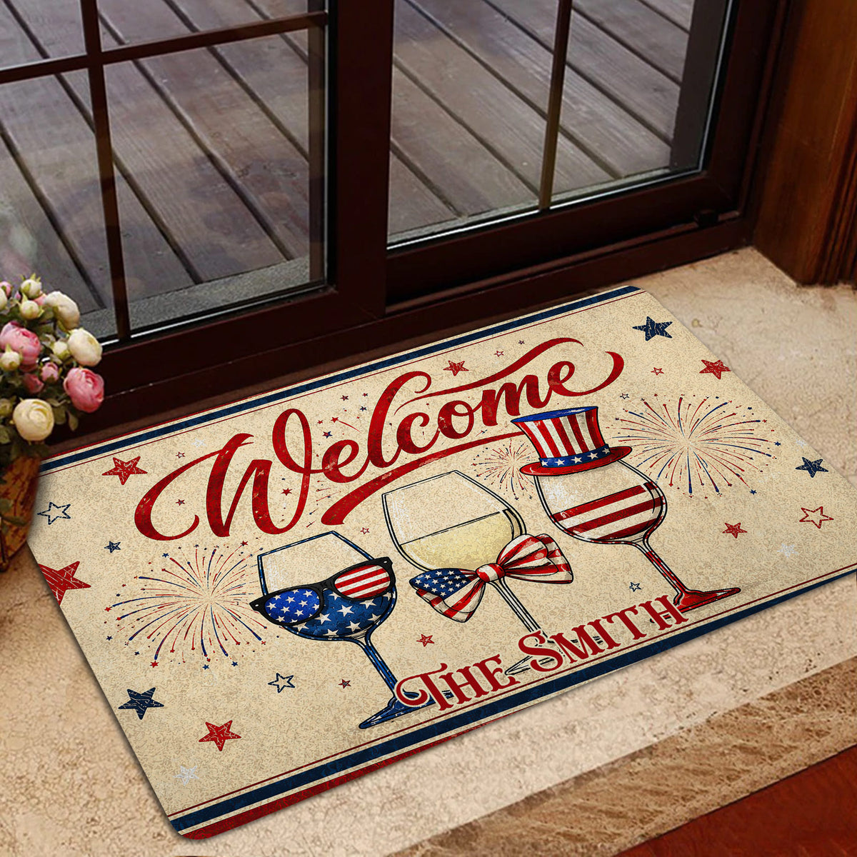 Patriotic wine-themed door mat displayed in a home entryway near a glass door