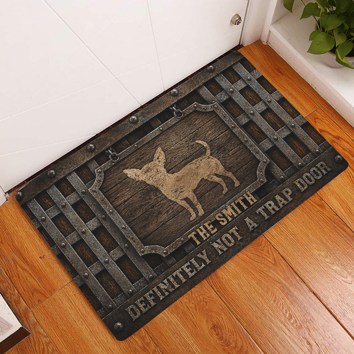 Chihuahua doormat styled in a rustic entryway beside a white door and hardwood floor