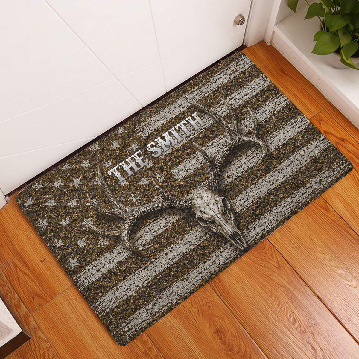 Hunting-themed doormat displayed in an entryway with a deer skull, antlers, distressed stripes and star details