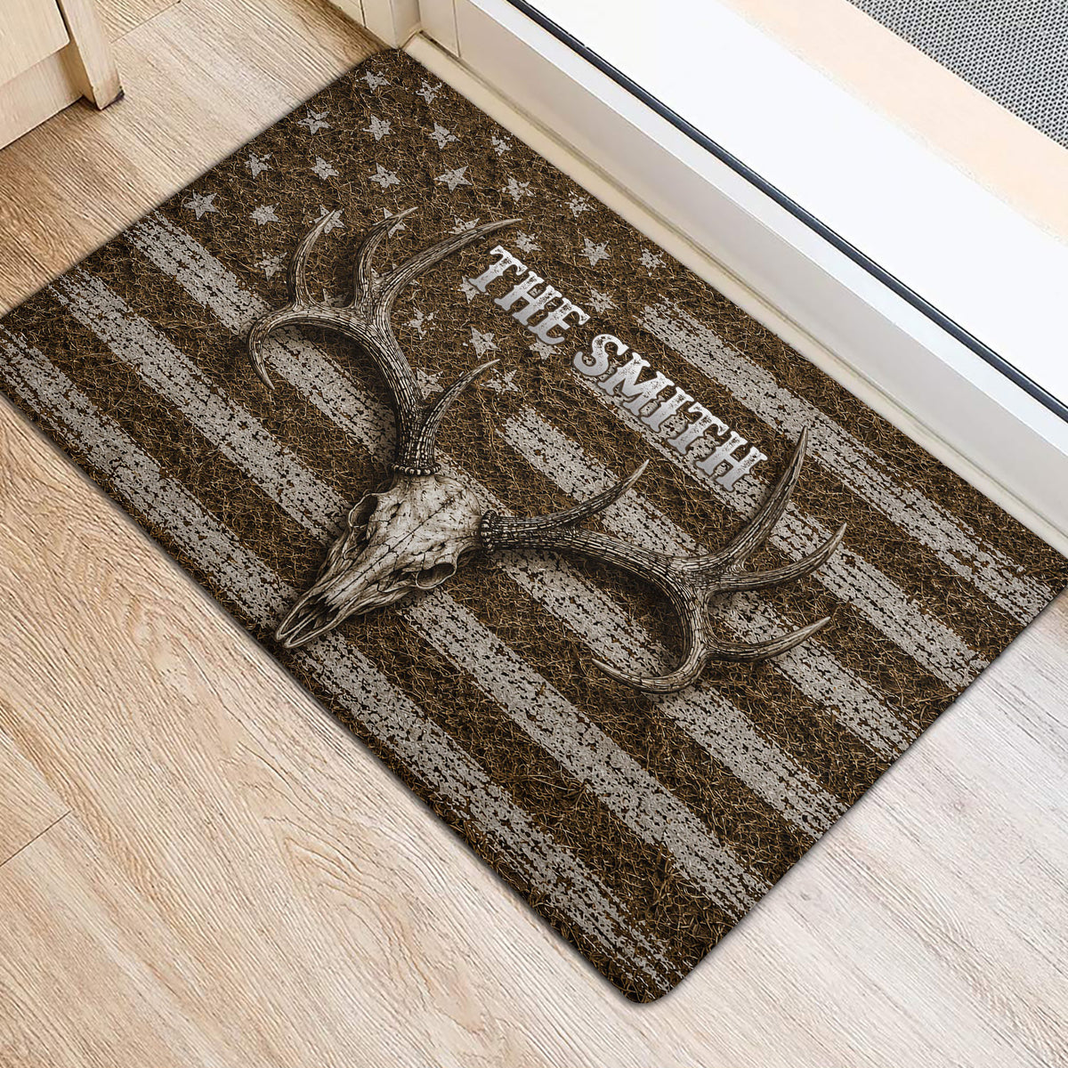 Antlered deer skull hunting rug positioned beside a doorway on a light wood floor