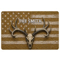 Hunting doormat with a deer skull, large antlers, rustic stars and distressed stripes in earthy brown and cream tones