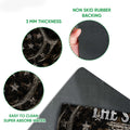 Close-up feature view of hunting doormat artwork with antlers, skull detail and textured backing
