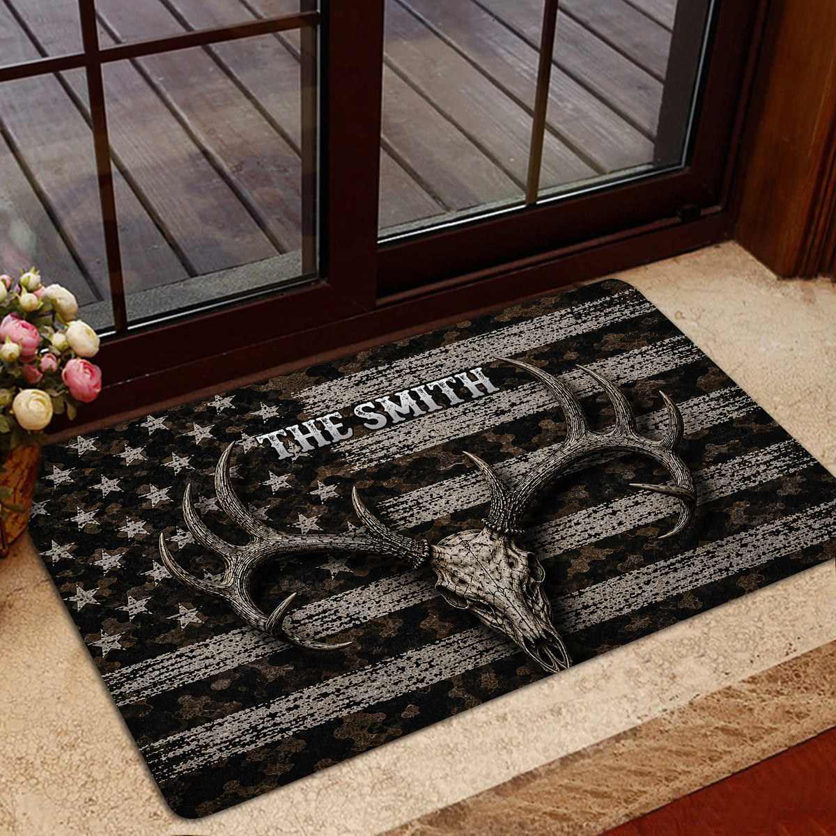 Antlered skull hunting rug styled at a glass entry door with camouflage and distressed stripe artwork