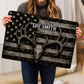 Hunting doormat held indoors, showing an antlered skull, camouflage design and star-patterned background