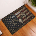 Antlered deer skull hunting doormat displayed in a wood-floored entryway beside a white door