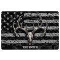Hunting doormat with deer skull and antlers over a distressed black and white flag-inspired pattern