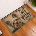 Yorkshire Terrier doormat styled inside a home entryway on a warm wood floor beside a white door