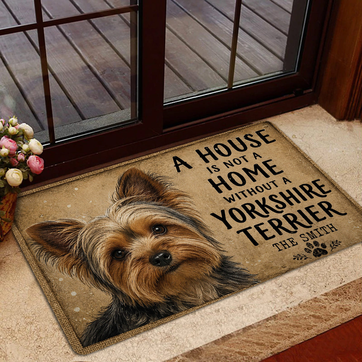 Yorkshire Terrier doormat placed by a glass door in a cozy home entrance with rustic neutral styling
