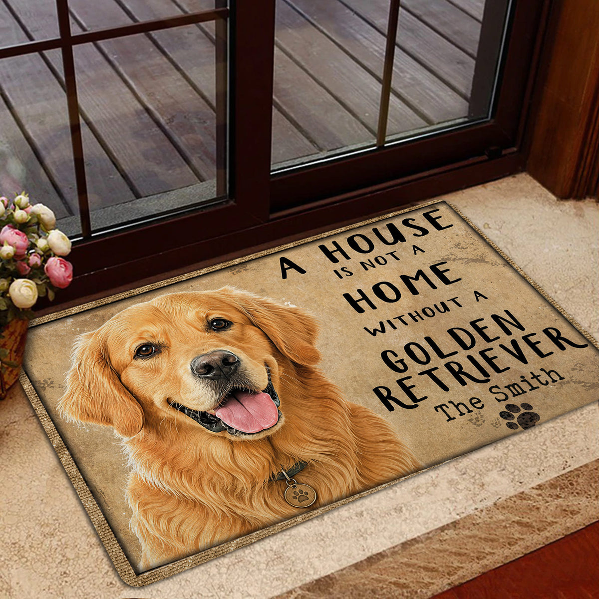 Golden Retriever door mat displayed inside a glass entry door beside a porch