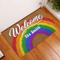 Rainbow Pride Welcome doormat displayed at a home entryway on a wood floor