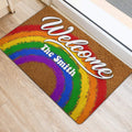 Colorful rainbow Welcome door mat positioned beside a bright interior doorway