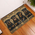 Rottweiler doormat displayed in a home entryway on hardwood flooring beside a white door