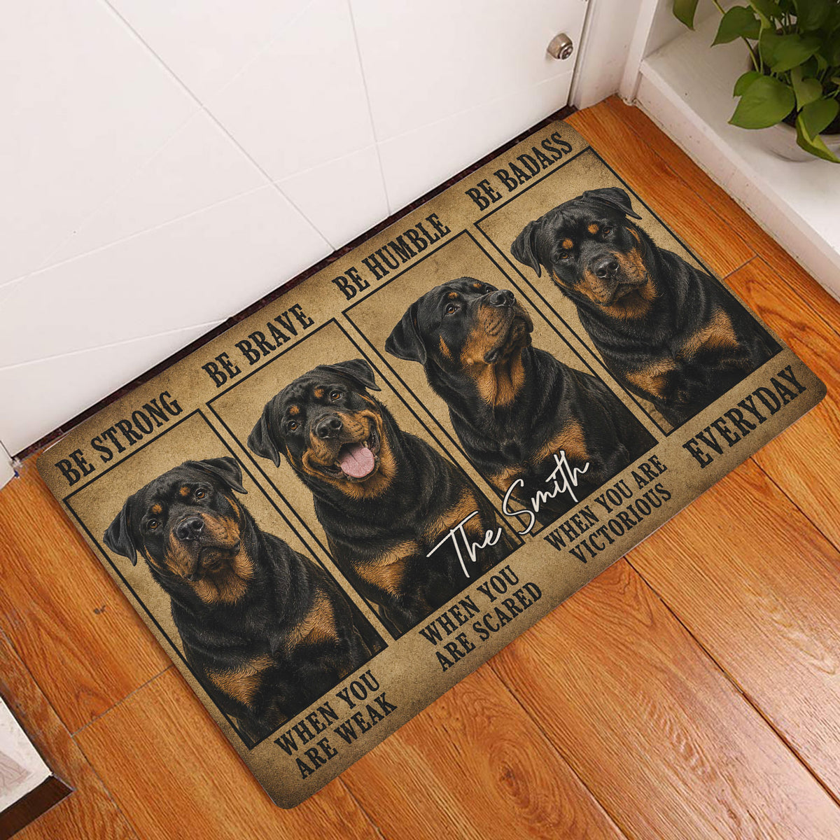Rottweiler doormat displayed in a home entryway on hardwood flooring beside a white door
