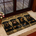 Rottweiler doormat styled at a glass entry door with warm wood framing and a home interior setting