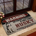 Vintage Husky entryway mat shown near a glass door with a bold warning design