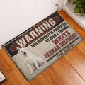 German Shepherd warning doormat displayed inside a front door entryway on warm wood flooring