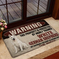 German Shepherd entryway mat placed beside a glass door with a vintage red, black and cream warning design
