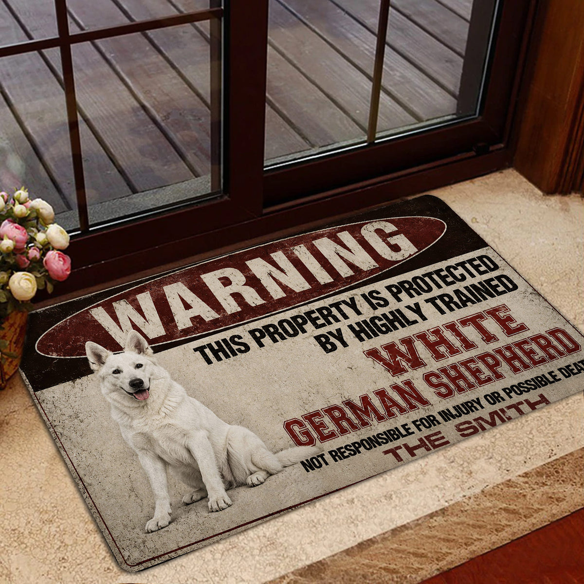 German Shepherd entryway mat placed beside a glass door with a vintage red, black and cream warning design