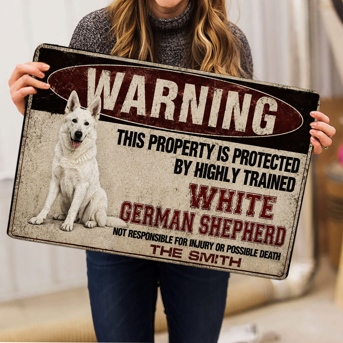 German Shepherd doormat held up indoors, showing the full vintage warning graphic and white dog illustration