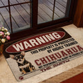 Chihuahua warning sign doormat styled in a home entrance beside a glass door