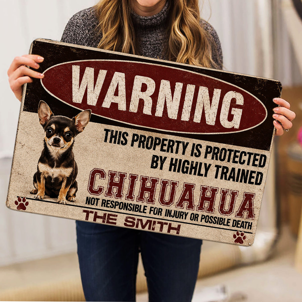 Person holding a Chihuahua warning artwork doormat indoors to show its full printed design