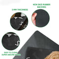 Close-up detail of the Goldendoodle doormat surface and rubber backing with paw print artwork
