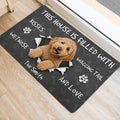 Goldendoodle door mat by an entrance featuring a cheerful dog portrait and playful paw print design